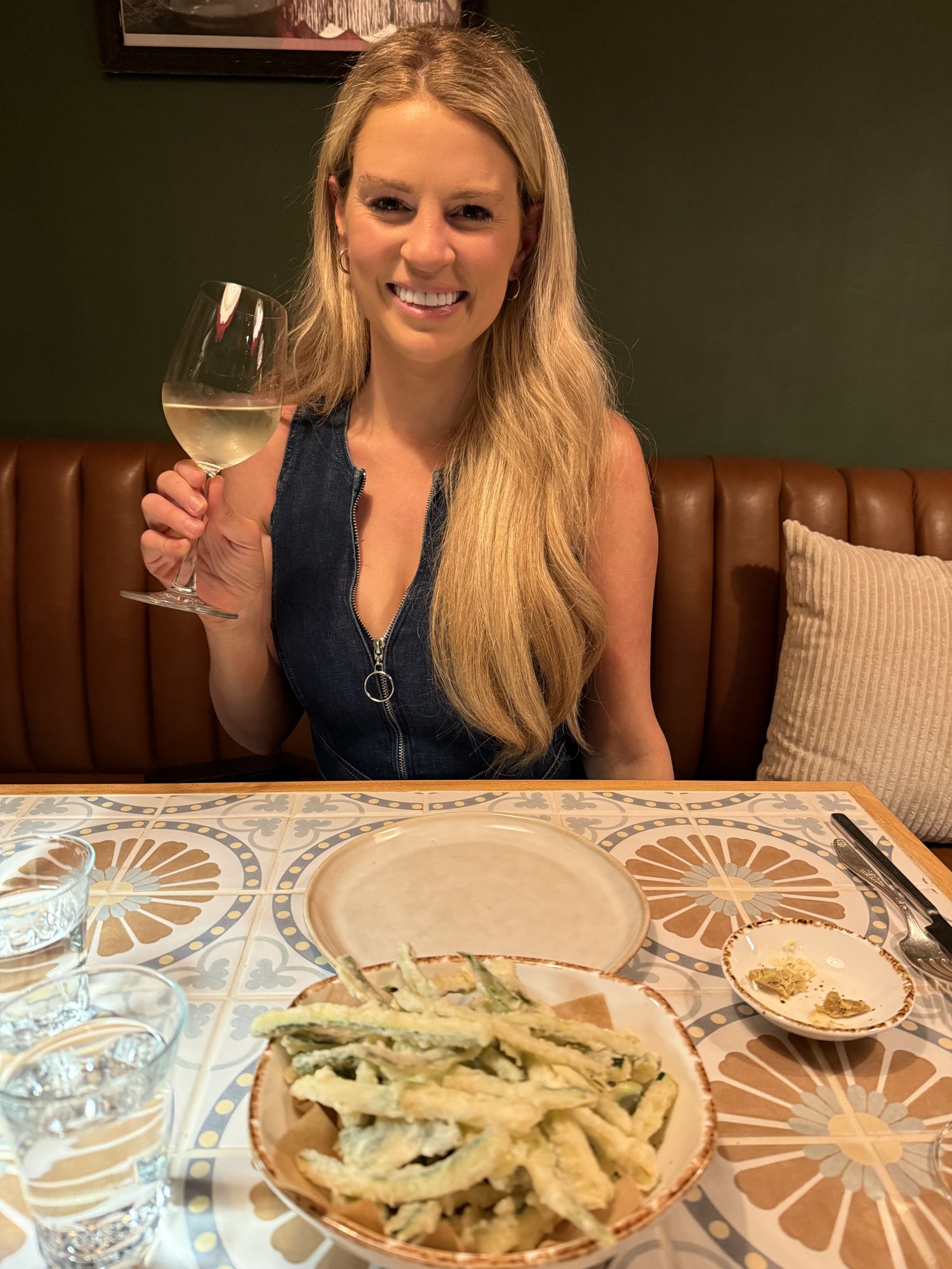 Savannah Sikes with a glass of wine at Bottega Salaria in Fredericksburg