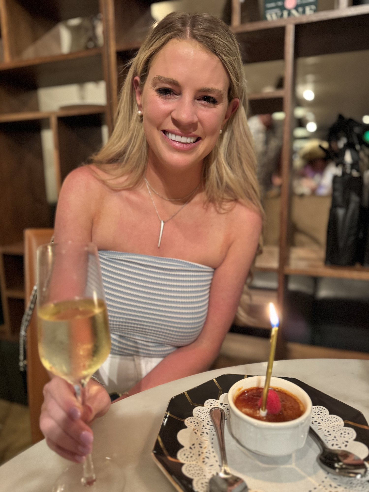 Savannah Sikes with a glass of bubbles at Vaudeville in Fredericksburg
