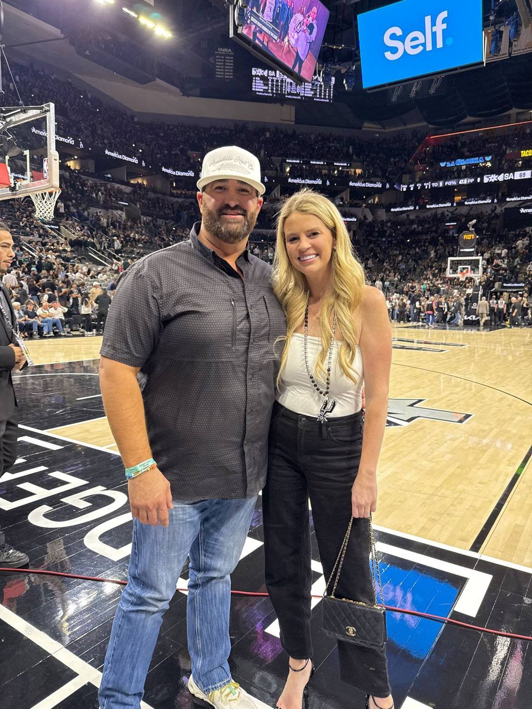 Savannah and David courtside at a Spurs game